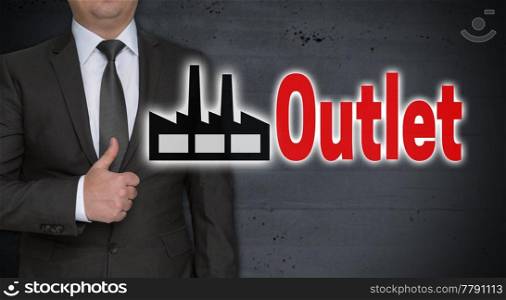Outlet concept and businessman with thumbs up.. Outlet concept and businessman with thumbs up