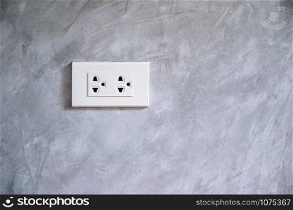 outlet Power saving Hand inserting electrical plug into outlet