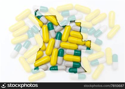 Outline angola map with transparent background of capsules symbolizing pharmacy and medicine