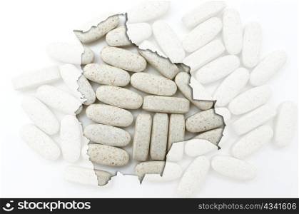 Outline bolivia map with transparent background of capsules symbolizing pharmacy and medicine