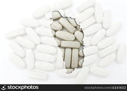 Outline dominica map with transparent background of capsules symbolizing pharmacy and medicine