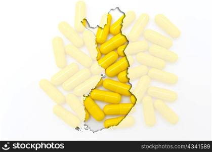 Outline finland map with transparent background of capsules symbolizing pharmacy and medicine