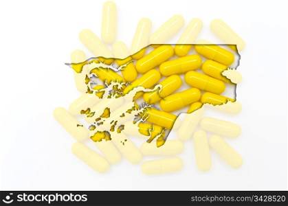 Outline guinea bissau map with transparent background of capsules symbolizing pharmacy and medicine