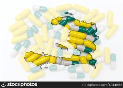 Outline haiti map with transparent background of capsules symbolizing pharmacy and medicine