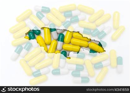 Outline jamaica map with transparent background of capsules symbolizing pharmacy and medicine