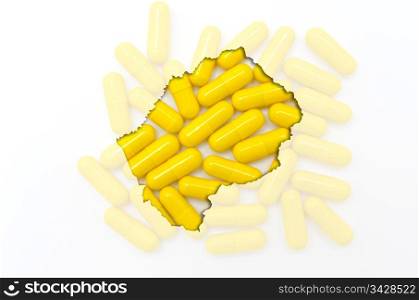 Outline lesotho map with transparent background of capsules symbolizing pharmacy and medicine
