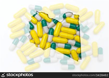 Outline libya map with transparent background of capsules symbolizing pharmacy and medicine
