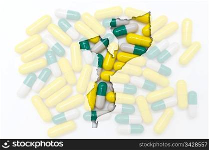 Outline mozambique map with transparent background of capsules symbolizing pharmacy and medicine