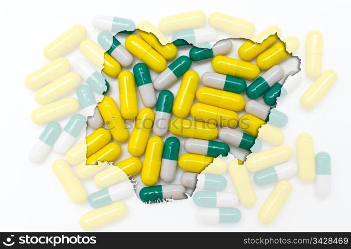 Outline nigeria map with transparent background of capsules symbolizing pharmacy and medicine