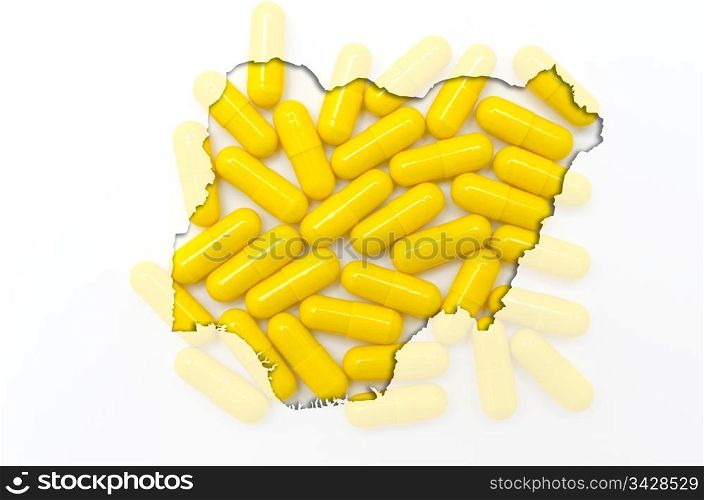 Outline nigeria map with transparent background of capsules symbolizing pharmacy and medicine