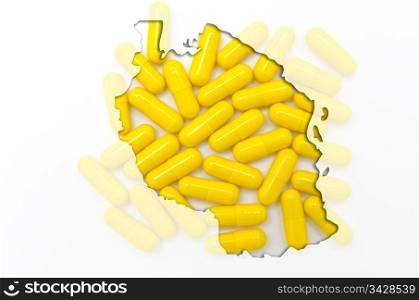 Outline tanzania map with transparent background of capsules symbolizing pharmacy and medicine