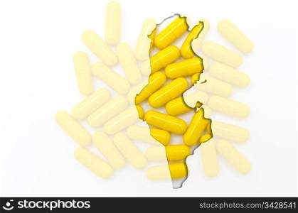 Outline tunisia map with transparent background of capsules symbolizing pharmacy and medicine