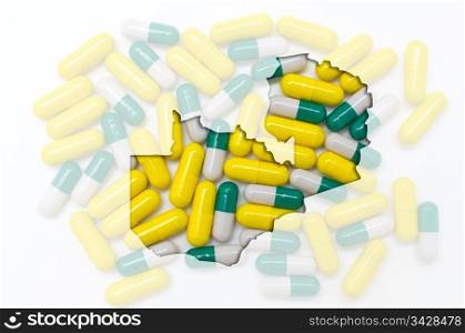 Outline zambia map with transparent background of capsules symbolizing pharmacy and medicine