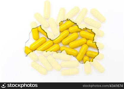 Outlined latvia map with transparent background of capsules symbolizing pharmacy and medicine