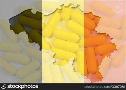 Outlined map of Belgium with transparent background of pills and belgian flag