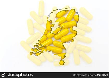 Outlined netherlands map with transparent background of capsules symbolizing pharmacy and medicine