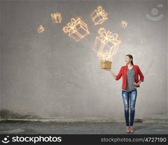Outside the box thinking. Young woman in red jacket holding carton box in hand