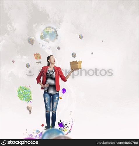 Outside the box thinking. Young woman in red jacket holding carton box in hand. Elements of this image are furnished by NASA