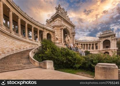 Outside view of historic Palais Longchamp in Marseille, France. One of the most impressive monument in the city.. Sunset over Palais Longchamp in Marseille, France. One of the most impressive monument in the city.