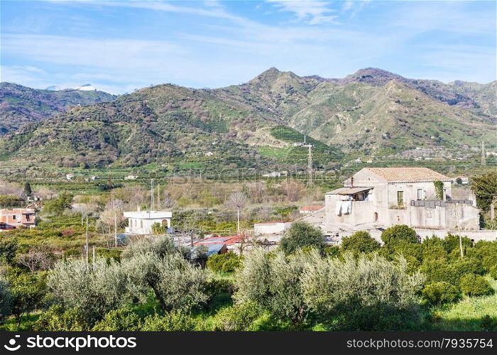 Outskirts of town Gaggi in green hills in spring day, Sicily, Italy