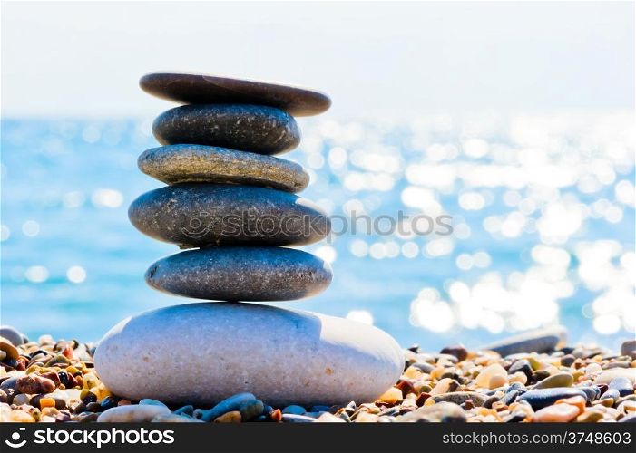 oval pile of stones on the beach