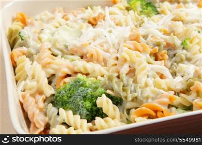 Oven-ready broccoli and fusilini pasta bake, with a creamy bechamel sauce and topped with grated parmesan