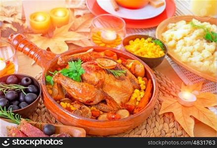 Oven roasted Thanksgiving Turkey on centerpiece of beautiful decorated festive table, healthy and tasty family dinner, traditional autumn holiday
