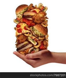 Over eating and compulsive indulgence of fast food concept as a hand holding up a huge stack of junk food as hamburgers hotdogs and french fries as an unhealthy diet nd bad nutrition symbol isolated on a white background.