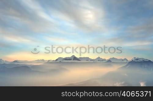 Over the mountains and hills glowing pink mist. Slowly the sun rises and shines a bright landscape. In the blue sky slowly float soft white clouds. Camera flies to meet the dawn.