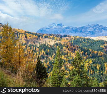 Overcast morning autumn alpine Dolomites mountain scene. Peaceful view near Valparola Pass, Belluno, Italy. Picturesque traveling, seasonal, nature and countryside beauty concept scene.