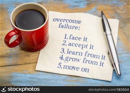 overcome failure tips - handwriting on a napkin with a cup of coffee
