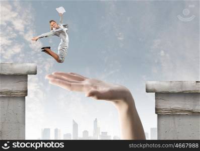 Overcoming difficulties. Businesswoman jumping over gap. Risk and challenge concept