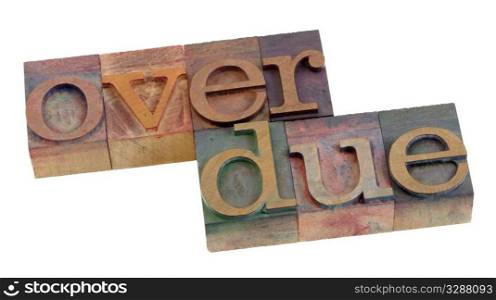 overdue word in vintage wooden letterpress printing blocks, stained by color ink, isolated on white