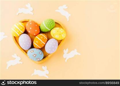 Overhead easter eggs with rabbit paper cut in shape heart isolated on pastel background, Funny decoration paper round blank, Happy Easter Day greeting card, composition banner web design holiday
