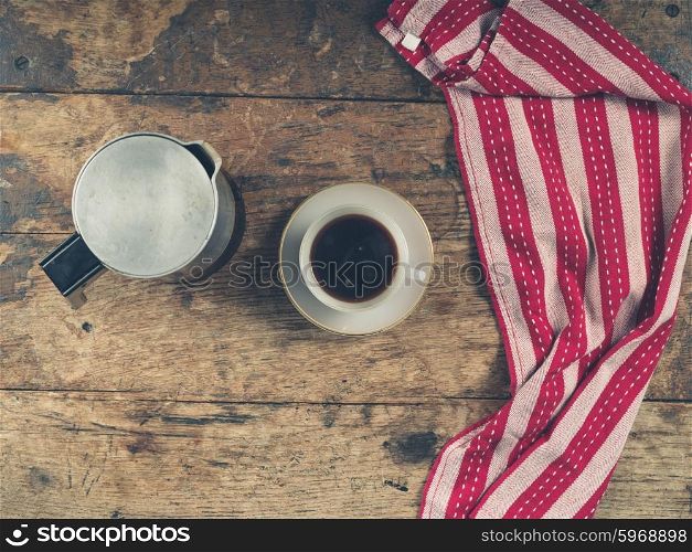 Overhead shot of coffee concept with cup, moka pot and tea a towel
