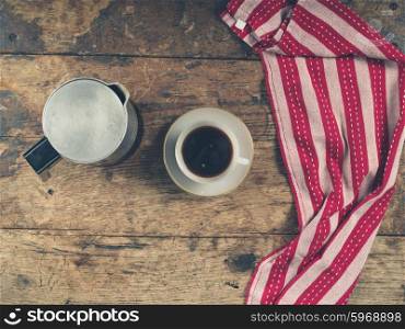 Overhead shot of coffee concept with cup, moka pot and tea a towel
