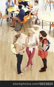 Overhead Shot Of Female Students Standing In Cafeteria
