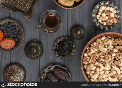 overhead view arabian tea dried fruits nuts ramadan