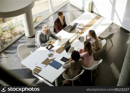Overhead view at group of multiethnic business people working together in the office