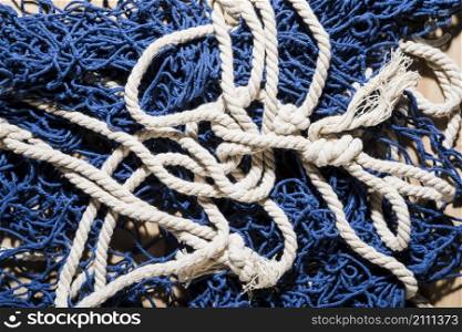 overhead view blue fishing net with white rope