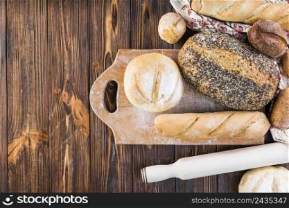 overhead view bread loaves chopping board wooden table