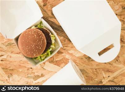 overhead view burger package wooden background
