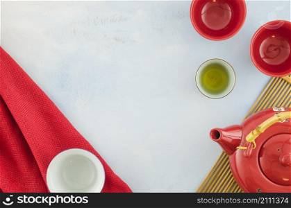 overhead view chinese teapot teacups white background
