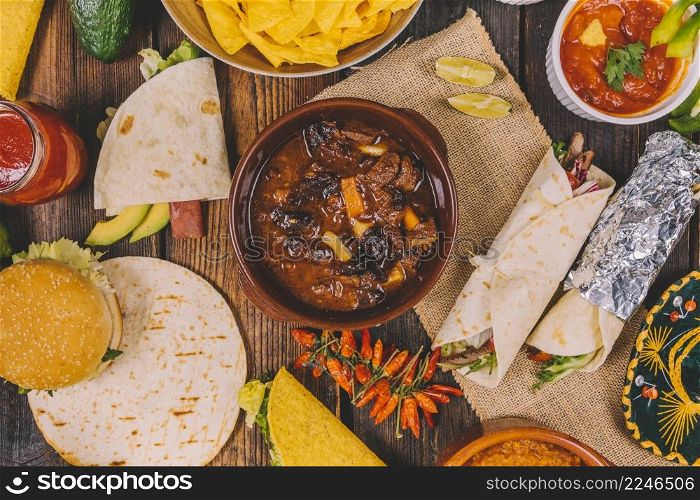overhead view delicious mexican food brown wooden table