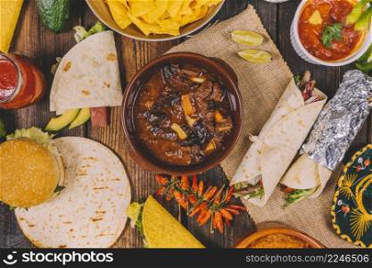 overhead view delicious mexican food brown wooden table