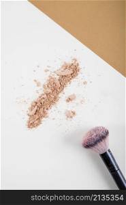 overhead view face powder brush dual colored background