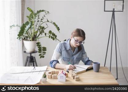 overhead view female real estate agent working office