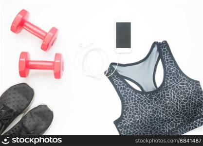 Overhead view fitness equipments, outfits and cellphone on white background, Fitness and Workout concept