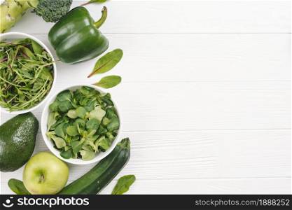 overhead view green healthy fresh vegetables white wooden desk . Resolution and high quality beautiful photo. overhead view green healthy fresh vegetables white wooden desk . High quality and resolution beautiful photo concept
