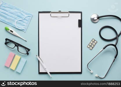 overhead view healthcare accessories near clipboard with plank paper spectacles background . Resolution and high quality beautiful photo. overhead view healthcare accessories near clipboard with plank paper spectacles background . High quality and resolution beautiful photo concept